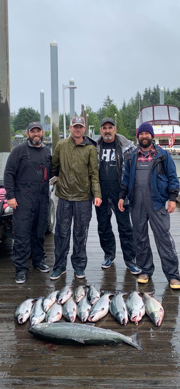 Crew on the dock with the day's limit of salmon
