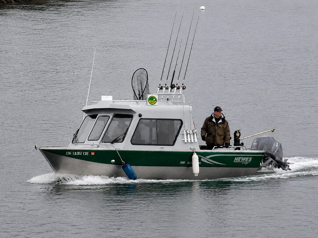 Hewescraft aluminum fishing skiff moored at the Coffman Cove dock, rigged with downriggers, GPS/sonar and VHF radio for self-guided salmon and halibut fishing